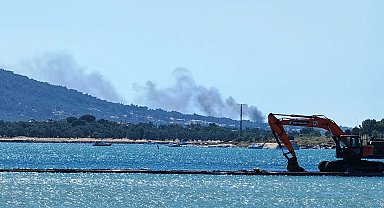Cunda'da makilik alanda çıkan yangın ormanı yaktı