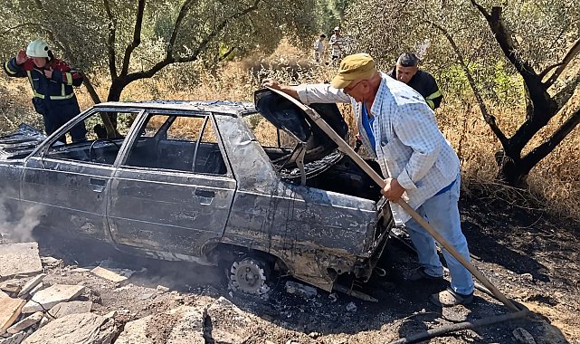 Yanan otomobilini uzaklaştırıp, alevlerin ormana sıçramasını önledi