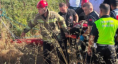 Dere yatağına uçan motosikletin sürücüsü yaralandı