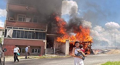 Alevler binanın garajını sardı, kardeşini kucağına alıp dışarı kaçtı