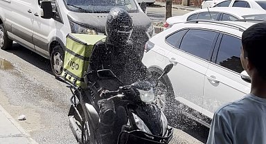 Diyarbakır'da sıcaklık 40 dereceyi aştı, hortumla serinleyenler objektife yansıdı