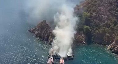 Fethiye'de koydaki tekne yandı, 115 yolcu suya atladı