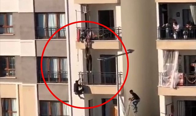 Balkondan düşmek üzere olan kız çocuğunu katları tırmanarak kurtardı