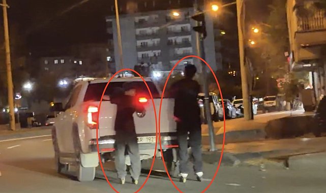 Patenli 2 çocuğun kamyonete tutunarak yolda ilerlediği anlar kamerada